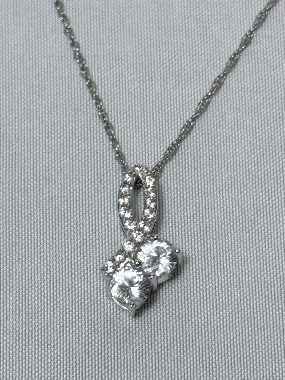 Helzberg diamonds white sapphire pendant set in sterling silver.